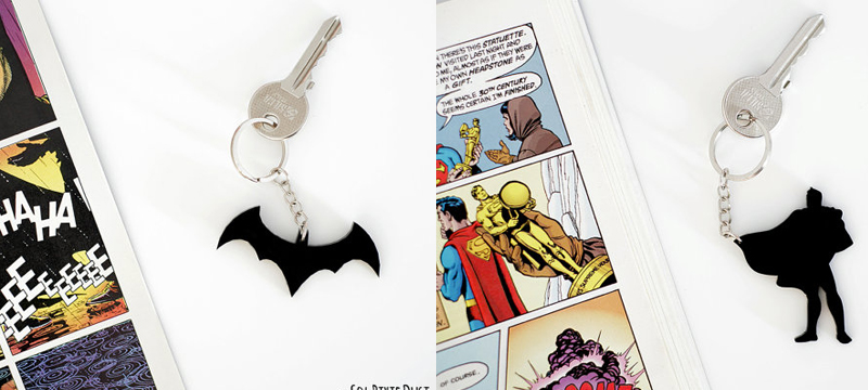 Laser cut black acrylic Batman and Superman keychains from SolPixieDust